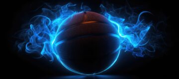 Black basketball with glowing neon lines on black background and smoke